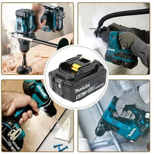 Makita 18V battery in use with cordless tools, lifestyle shot