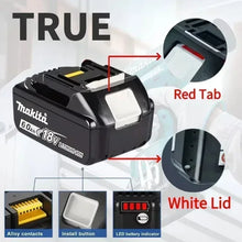 Makita 18V battery close-up, red tab and white lid on black