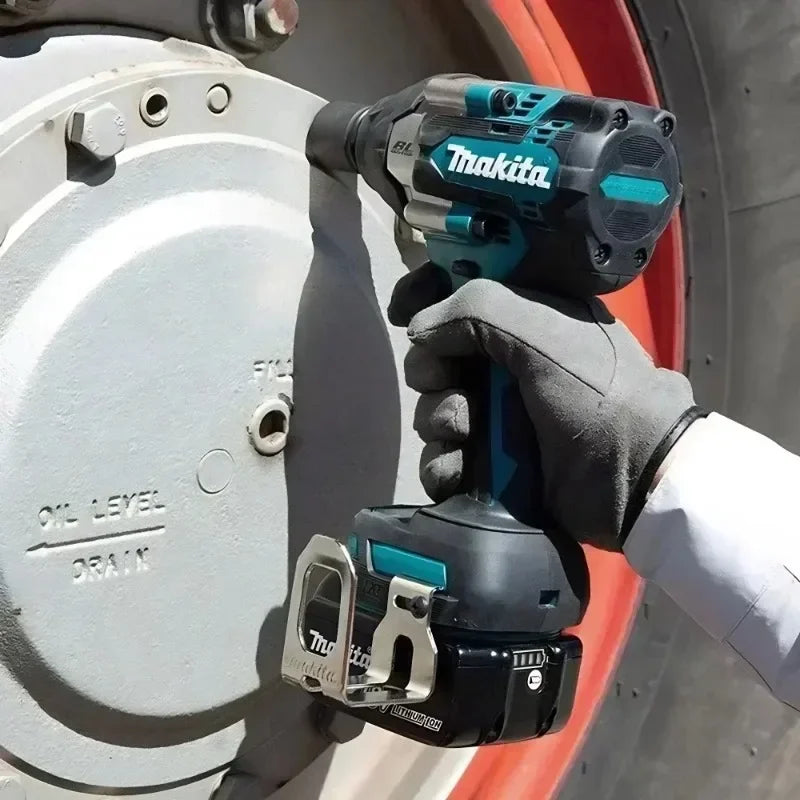 Makita DTW700 lifestyle use on wheel with gloved hand