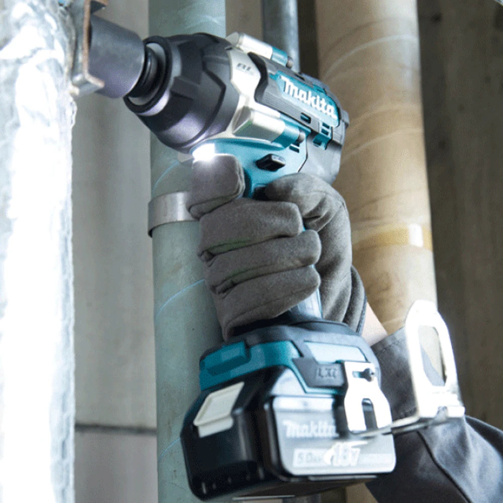 Makita DTW700 lifestyle use, cordless impact wrench with LED light