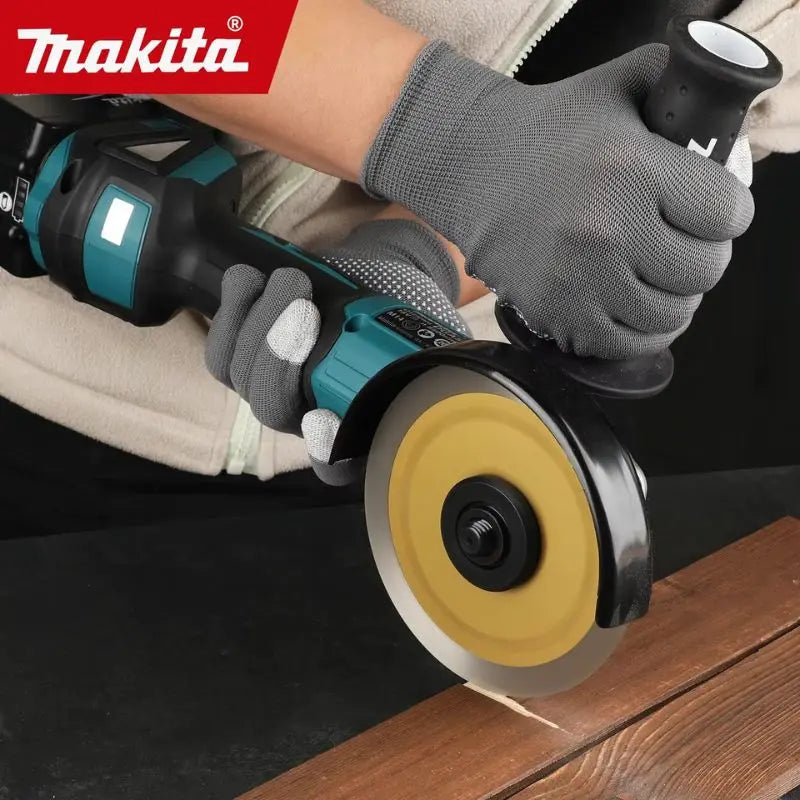 Makita DGA504 detail close-up of ergonomic handle and cutting disc, black blue yellow