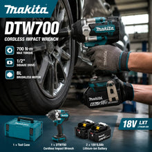 Makita DTW700 lifestyle front view, blue and black cordless impact wrench