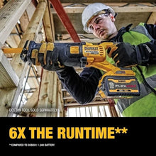 DEWALT DCB609 with reciprocating saw lifestyle shot, black and yellow