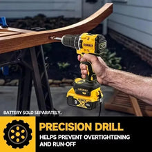 DEWALT DCD805 in use, user holding yellow and black drill for woodworking