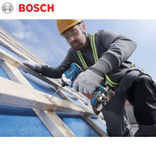 Bosch GDR 18V-215 lifestyle shot, worker on ladder using impact driver