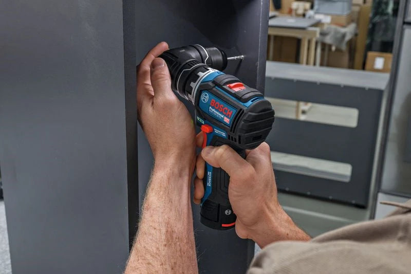 Bosch cordless drill lifestyle on metal surface, blue and black ergonomic grip