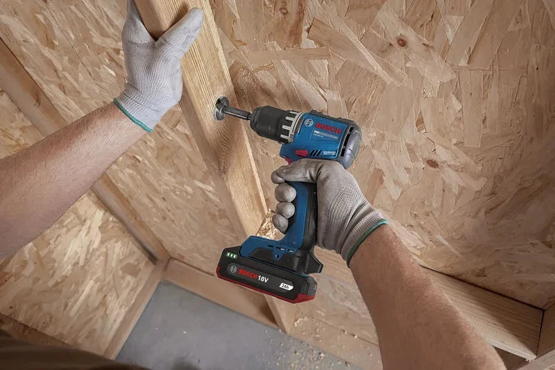 Bosch GSR18V-52 lifestyle view with screwdriver attachment, metal chuck, blue-black-red