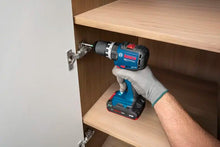 Bosch GSR18V-52 lifestyle shot with screwdriver attachment, metal chuck, blue-black-red