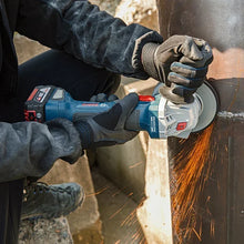 Bosch angle grinder lifestyle cutting metal outdoors, blue and black