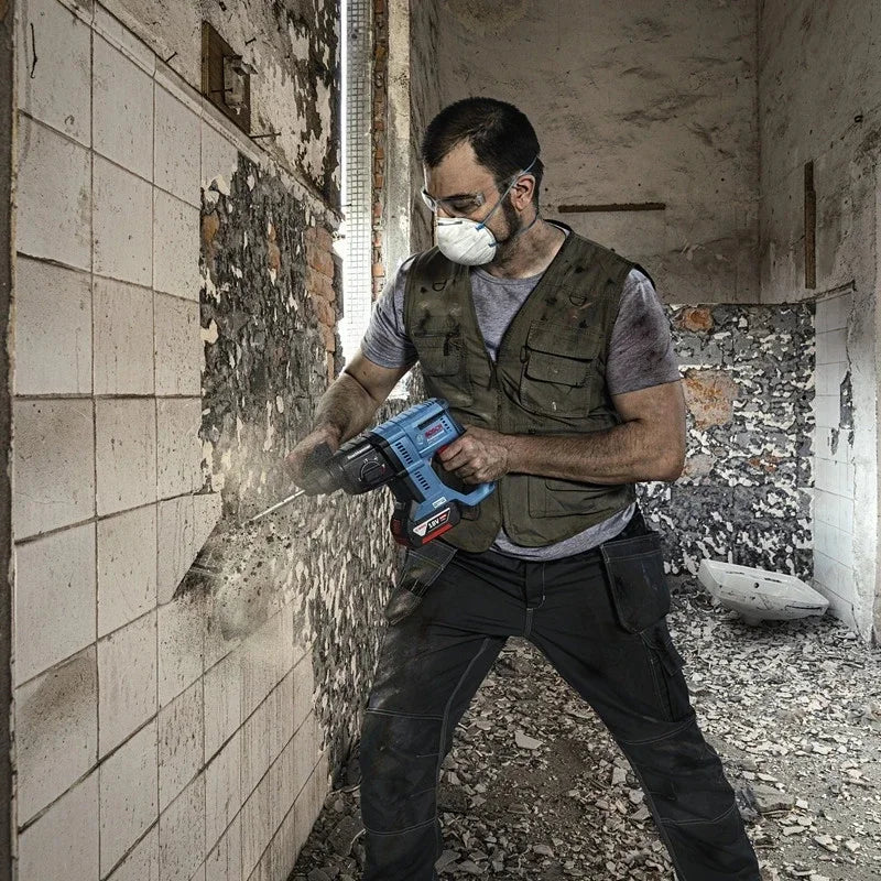 Bosch GBH 180-LI lifestyle shot of man using rotary hammer outdoors