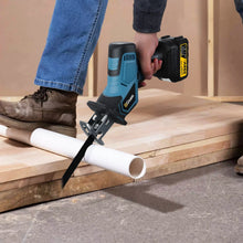 Gisam saw cutting PVC pipe, hands-on lifestyle shot in natural setting
