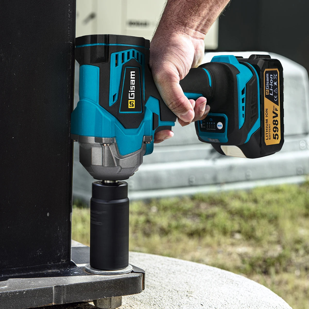 Gisam handheld impact wrench in use, working on equipment outdoors