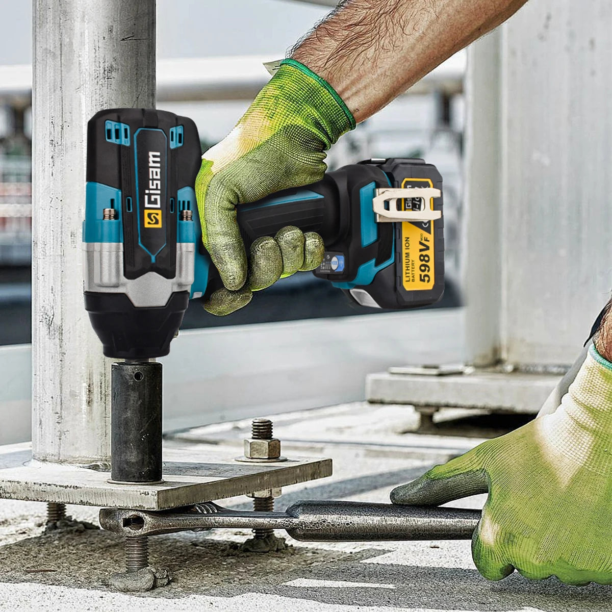 Gisam impact wrench lifestyle shot, person using black and blue cordless tool