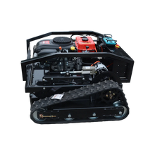Side view of tracked remote control mower with engine compartment, black red