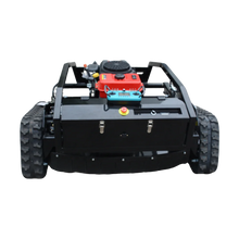 Back view of tracked mower with engine compartment and control panel, black red