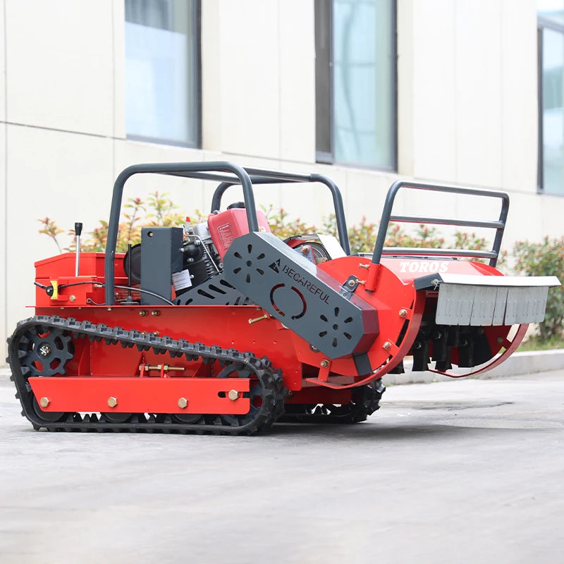 Remote control lawn mower side view, tracked wheels and mowing deck