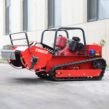 Remote control lawn mower side view, tracked wheels and mowing deck
