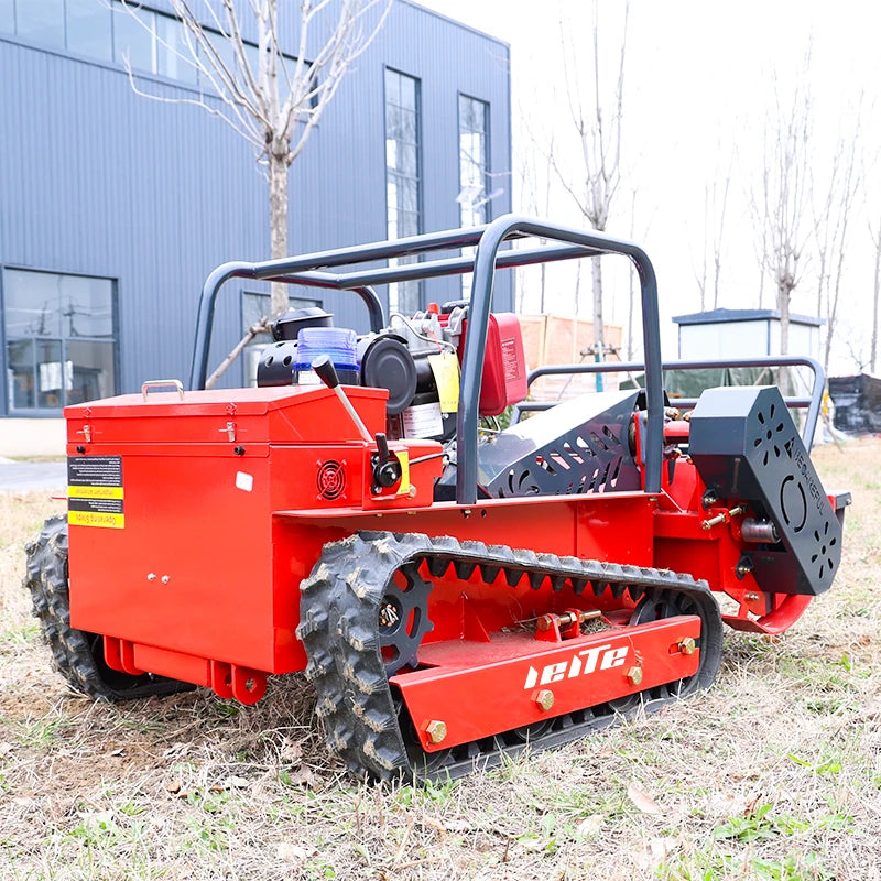 LEITE red tracked mower side view with bucket attachment