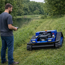 AIWEIYA tracked robot mower in blue and green, remote control lifestyle shot