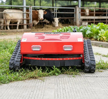SAAO robot lawn mower front view, red and black tracked agricultural robot