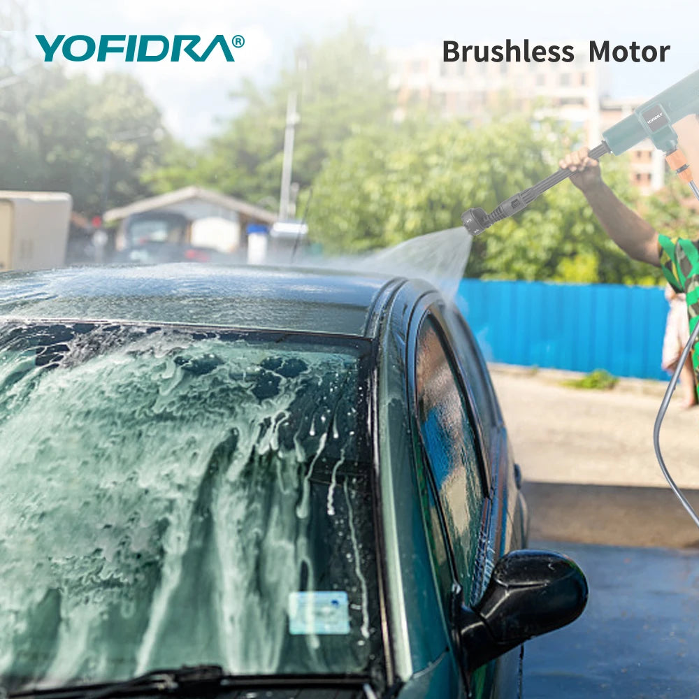 Yofidra car washing lifestyle shot with blue and green water spray outdoors