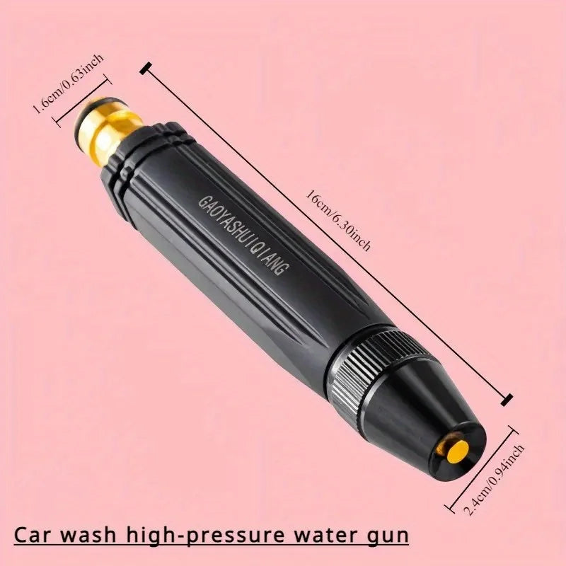 Close-up of compact spray nozzle in black and gold on solid background