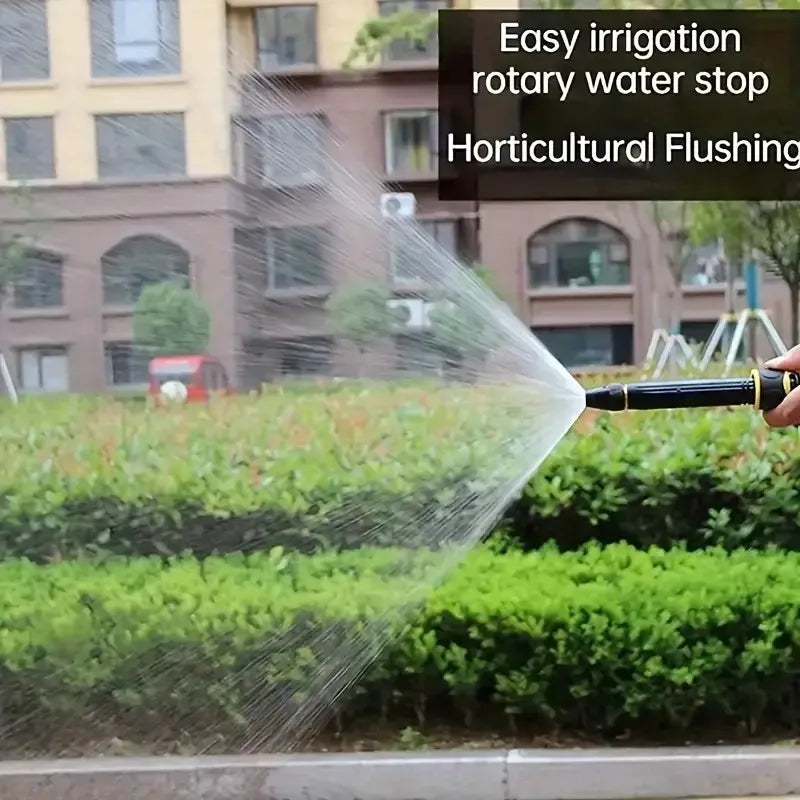 Water mist spray in action from nozzle, clear and black, outdoor setting