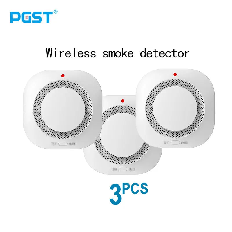 PGST wireless smoke detector packaging, three pieces, white unit with red indicator