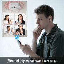 PGST WiFi smoke detector remote monitoring lifestyle, man holding phone