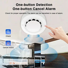 Smoke detector detail in white and black with one-button detection