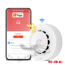 Tuya WiFi smoke detector detail close-up with smartphone app and WiFi