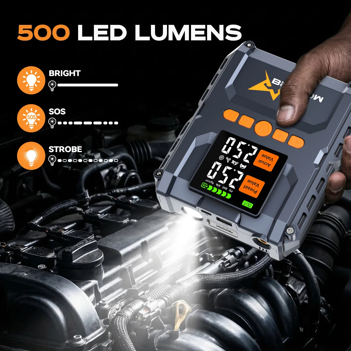 Detail view of the LED jump starter showcasing its digital display and compact design in black and orange.