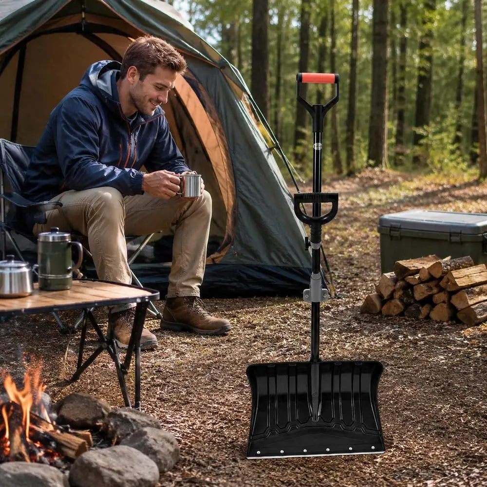 18 inch snow shovel near a campfire with a tent in background