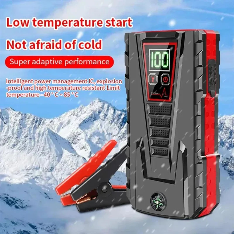 Car jump starter in black and red with digital display, front view.