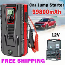 Car jump starter in black and red with digital display, front view.