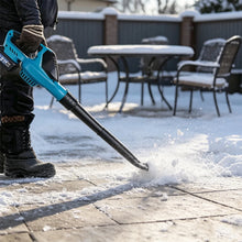 Magnitt turbo blower in snow, blue and white outdoor clearing scene