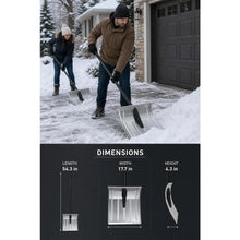Two people using metal shovels on a snow-covered driveway.