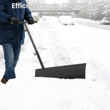 Person using ergonomic snow shovel in winter scene