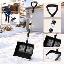 Lightweight and portable snow shovel with wide blade in black, lifestyle shot.