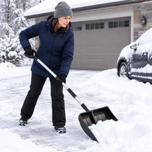 Lightweight and portable snow shovel with D-grip handle in black, woman using in lifestyle shot.