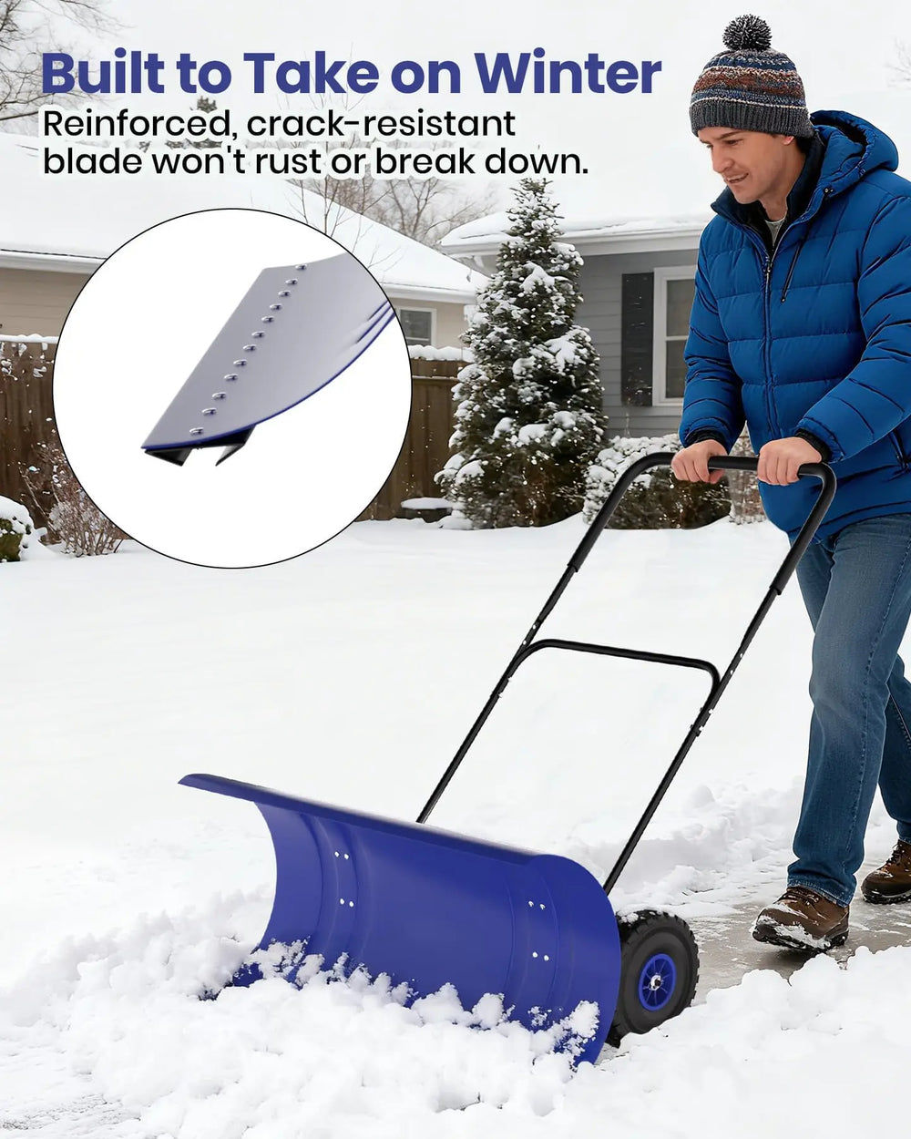 Metal snow shovel with wheels, blue ergonomic handle in natural setting