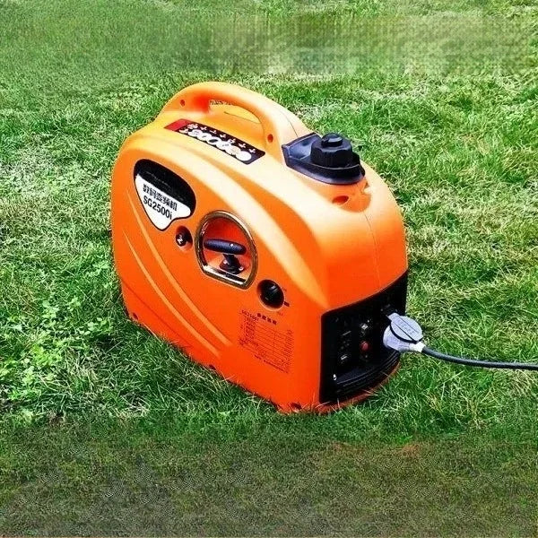 Portable generator in an outdoor setting with orange and black colors.